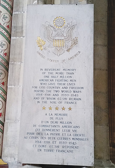 A stone slab with text memorializing an American Soldier