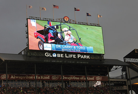 The Jumbotron screen shows Dr. Larry Darlege and Toro