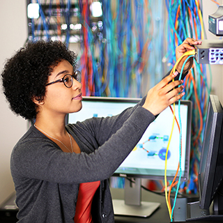 Woman working with network cables